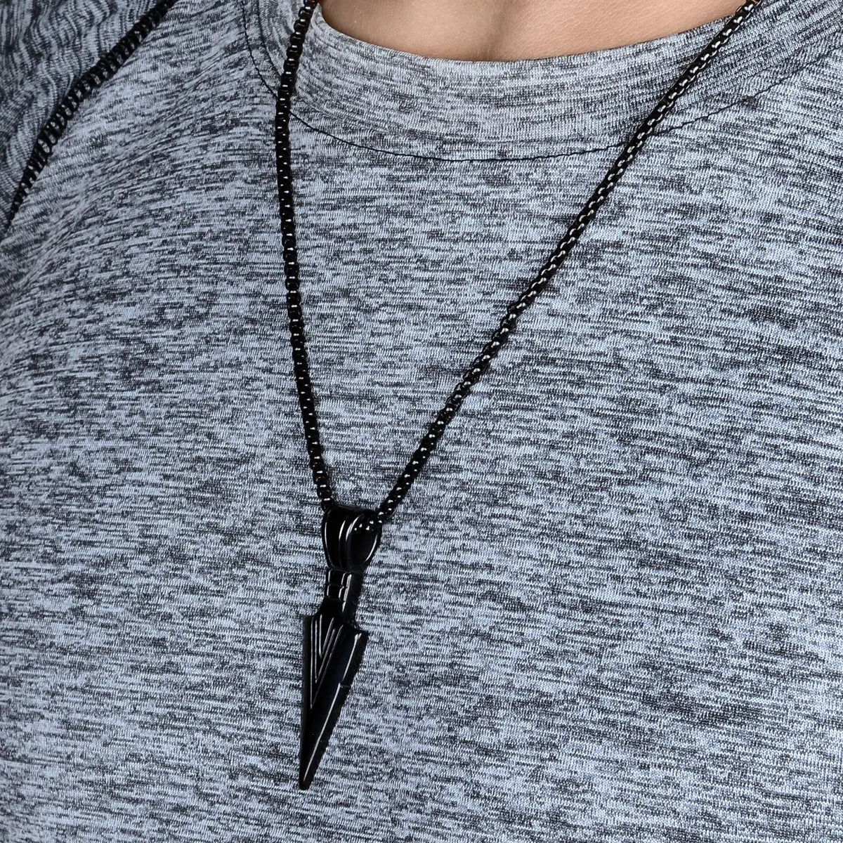 Black necklace with a pendant for men on a gray shirt by Supreme Stud
