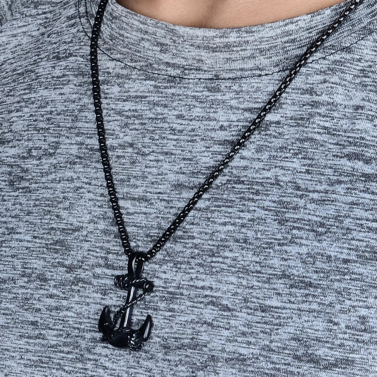 Black anchor pendant for men on a gray shirt by Supreme Stud
