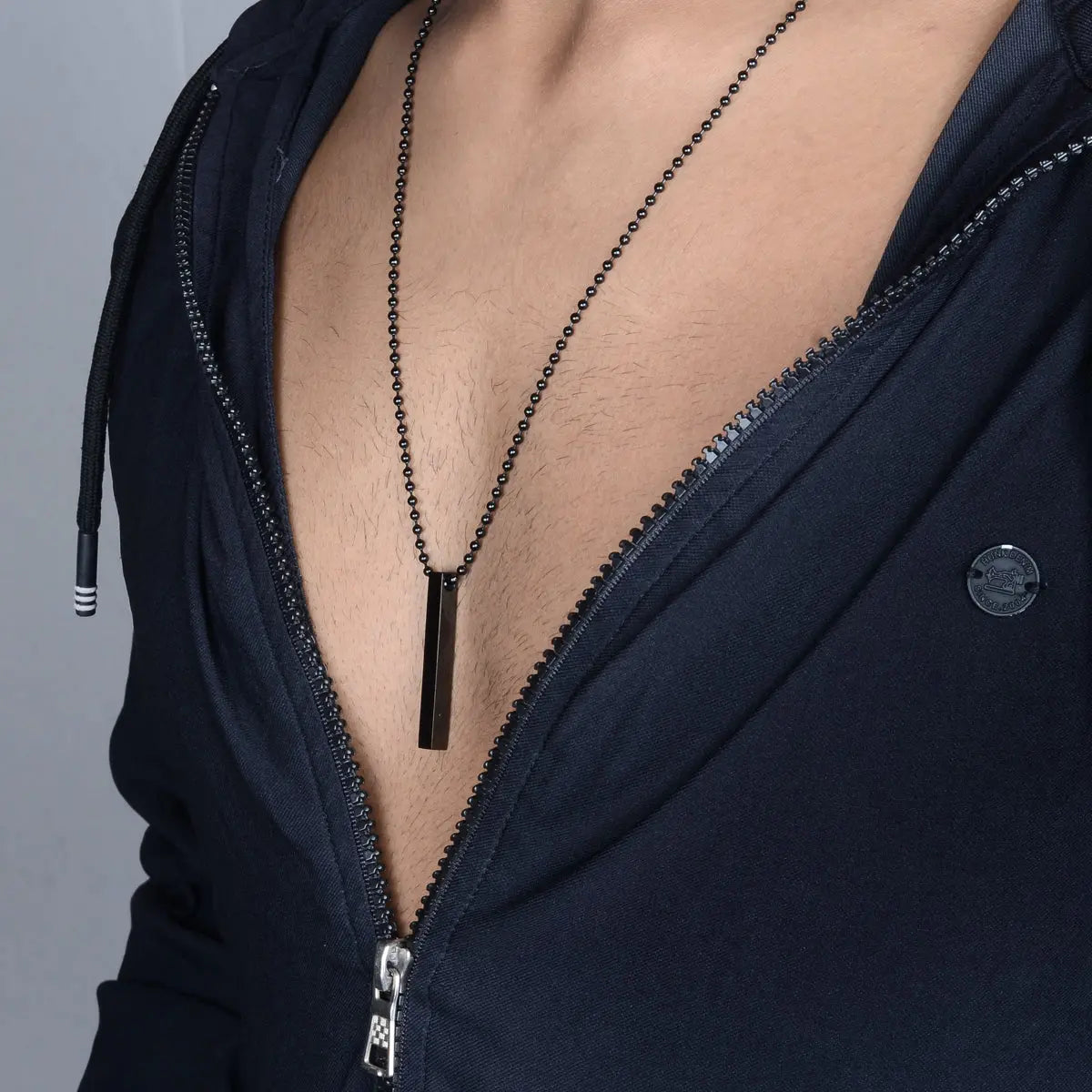 Black steel pendant for men on man by Supreme Stud