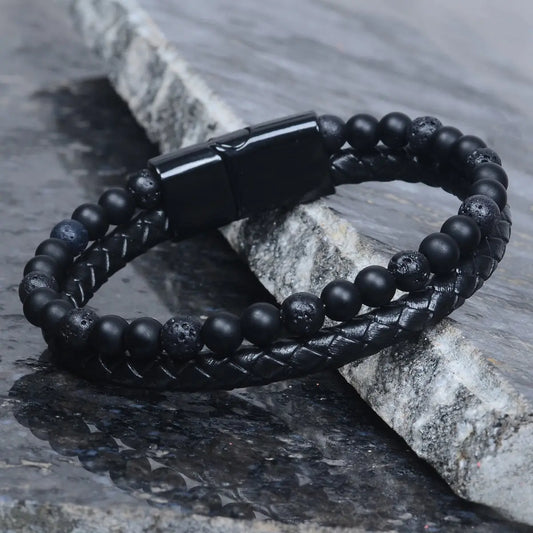 Black beaded leather bracelet for men on a stone surface by Supreme Stud