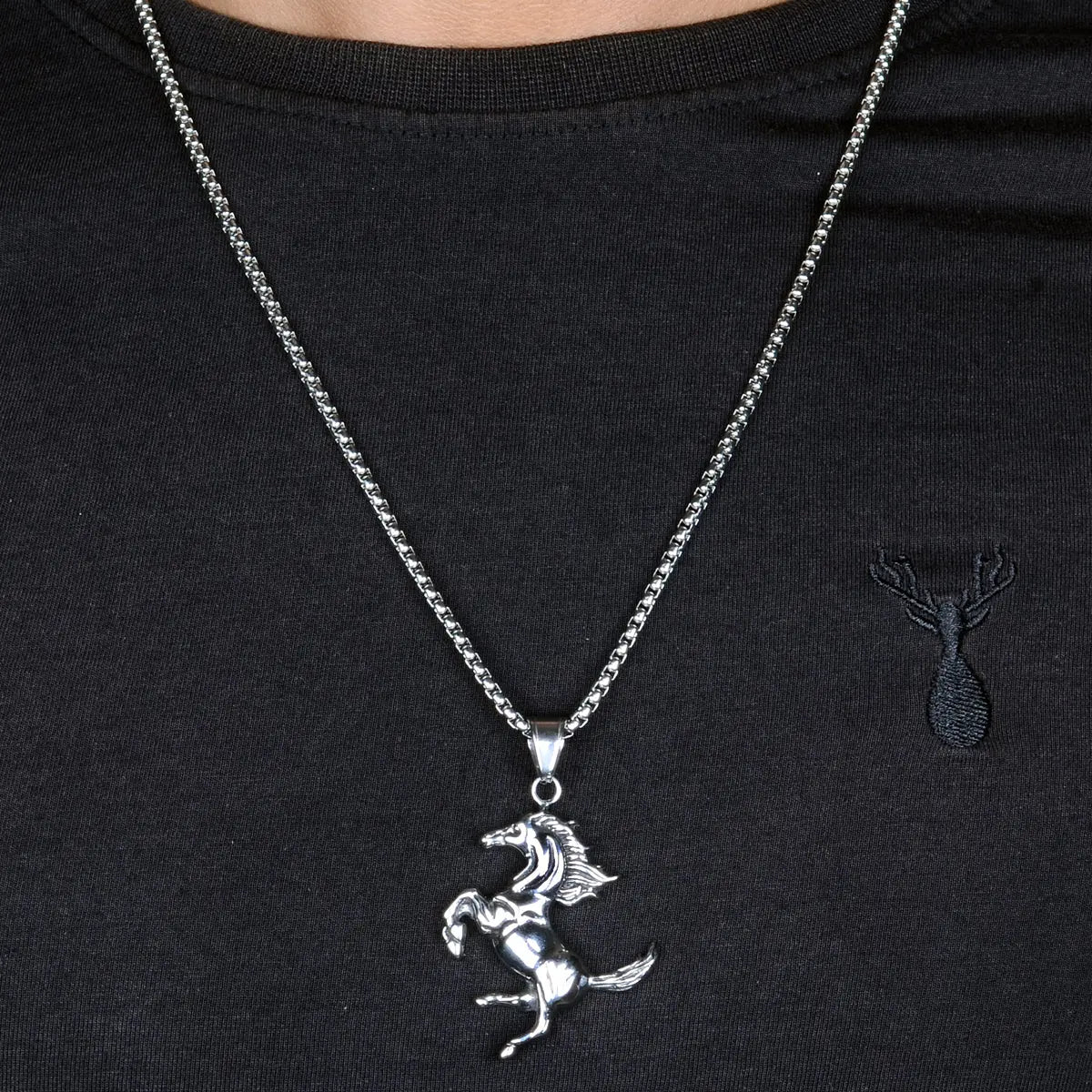 Steel necklace for men with a horse pendant on a black shirt by Supreme Stud