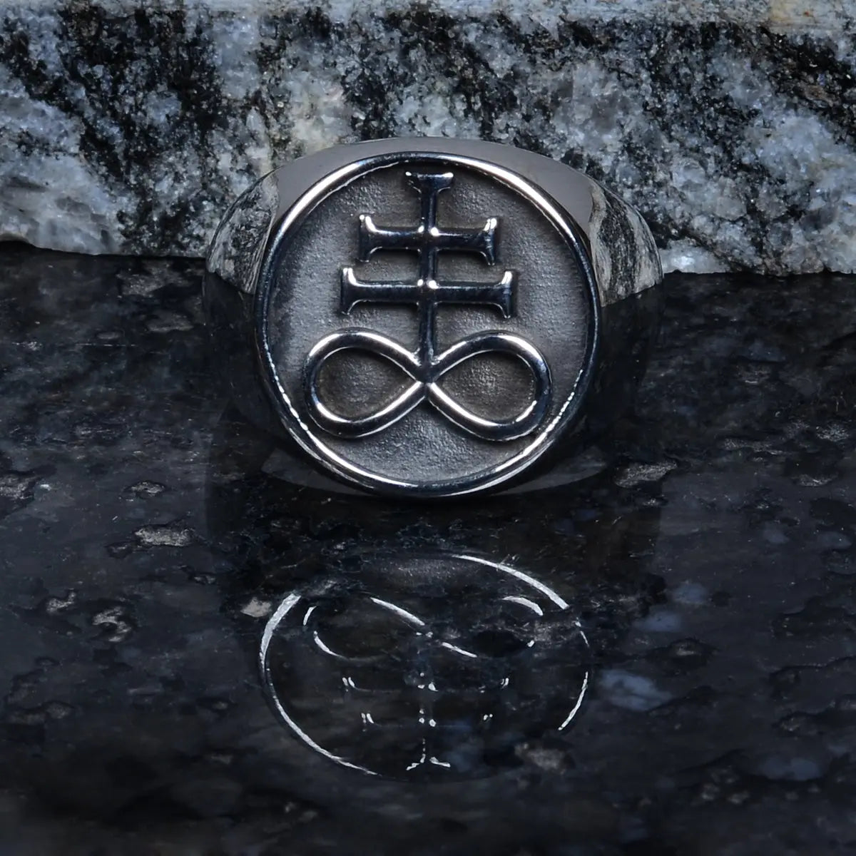 Steel ring for men with a symbol on a dark surface by Supreme Stud