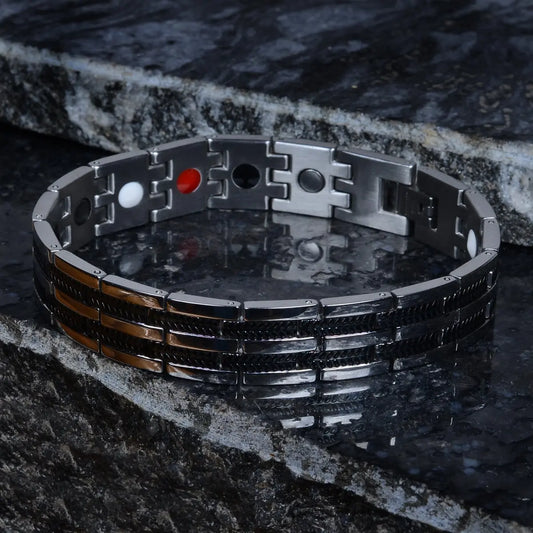 Metallic bio-magnetic bracelet for men with geometric design on a dark stone surface by Supreme Stud